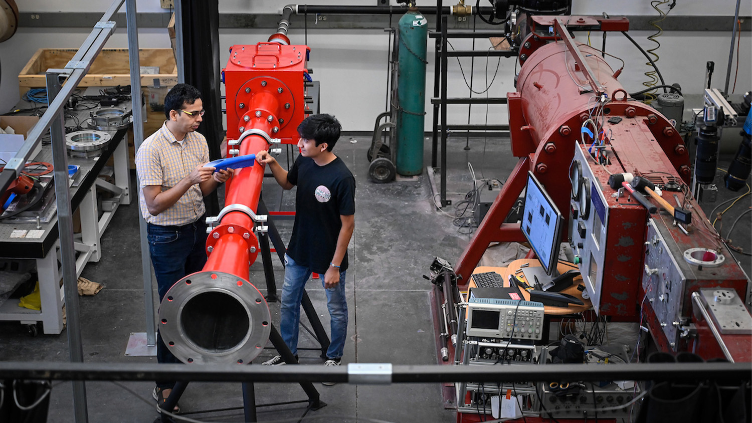 Aerospace engineering students work in the nearly completed hypersonic wind tunned lab. The students are working under Dr. Venkat Narayanaswamy.