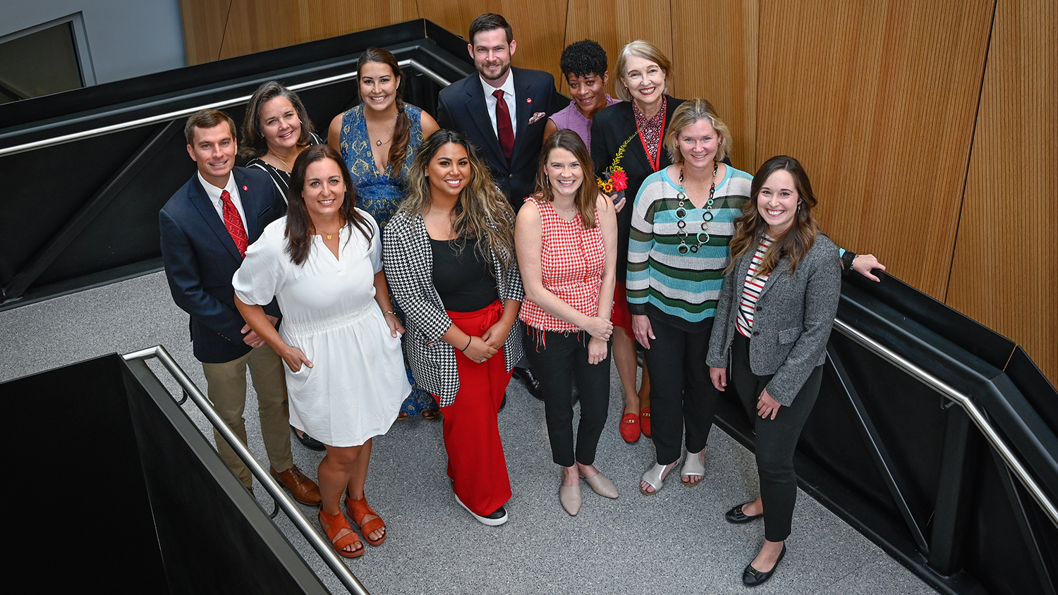 The Engineering Foundation staff pose for a picture on one of the stairwells in Fitts-Woolard Hall.