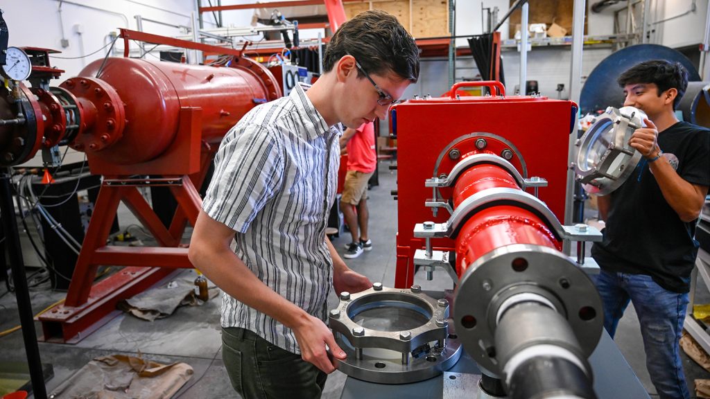 Aerospace engineering students work in the nearly completed hypersonic wind tunned lab. 