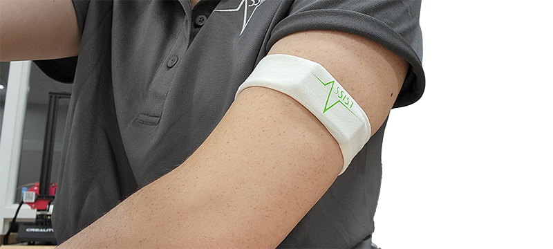 Screen-printed dry electrodes worn above elbox of left arm.