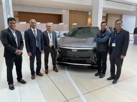 Husain with former students who designed various parts of the GM Chevrolet Lyriq EV.