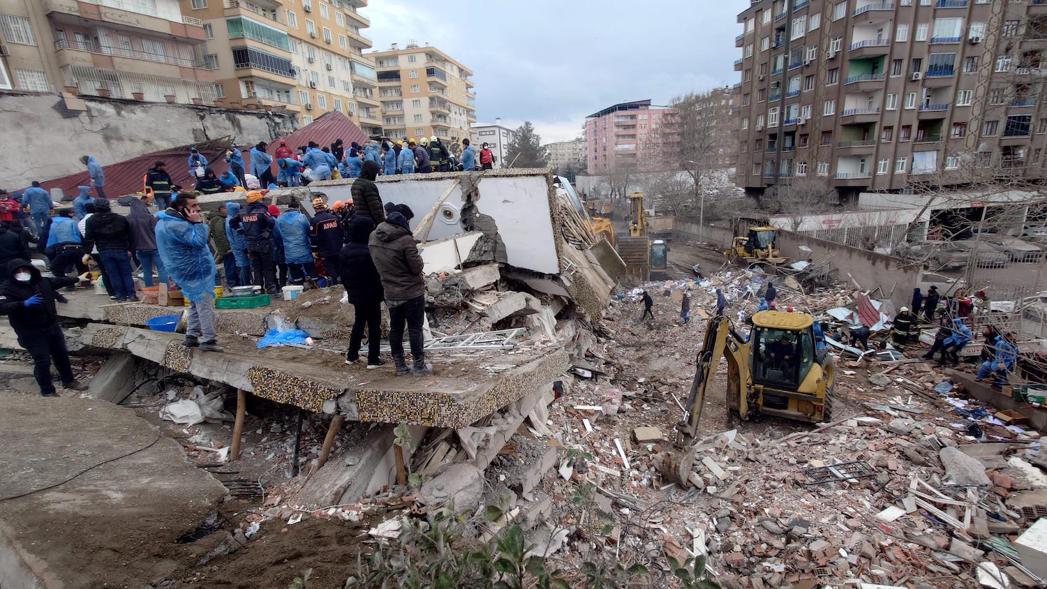 Rescue workers search through rubble following an earthquake in the southeastern Turkish city of Diyarbakir.