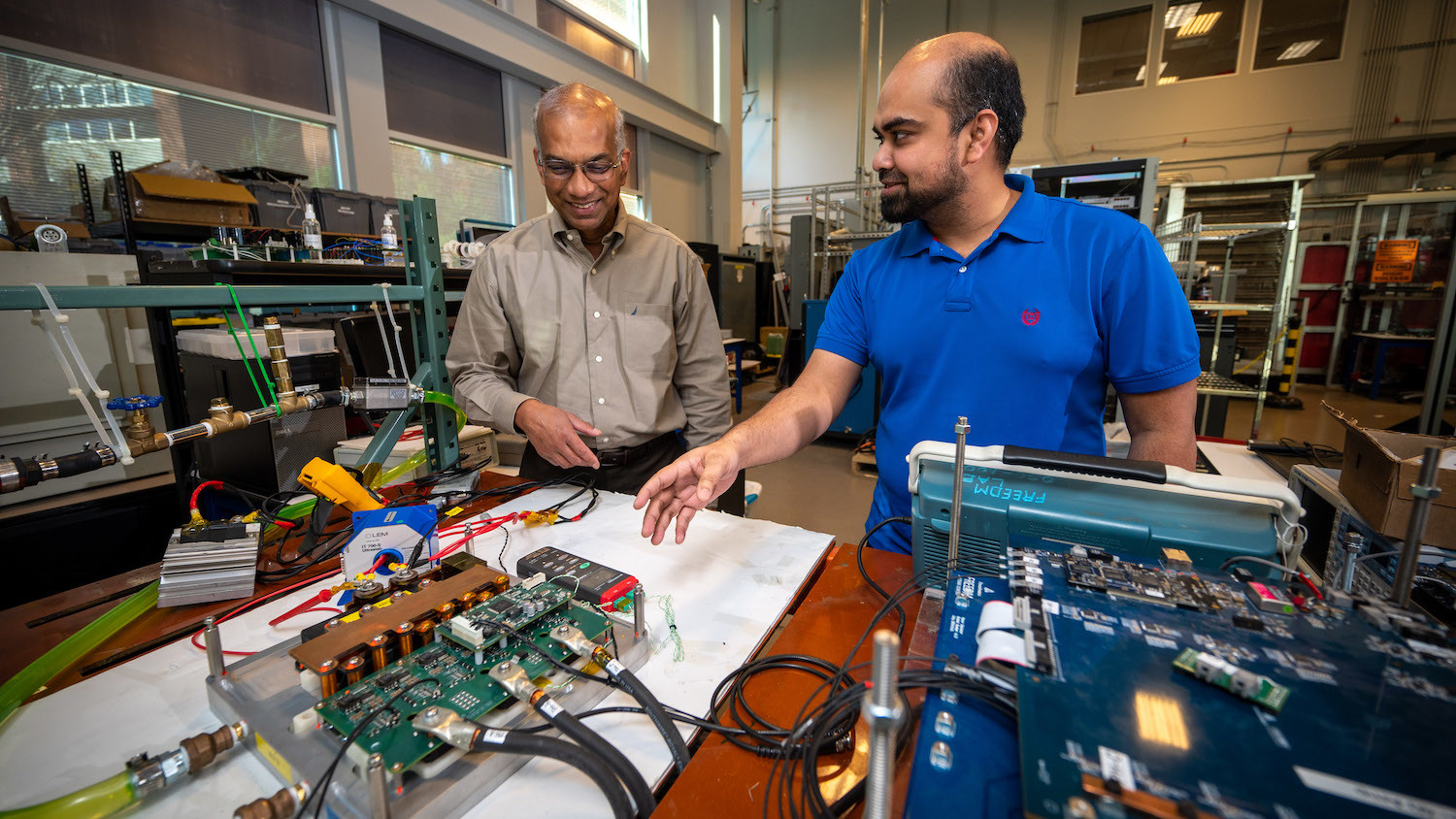 Iqbal Husain, left, works with Taohid Latif ’22 on the latter’s Ph.D. project.