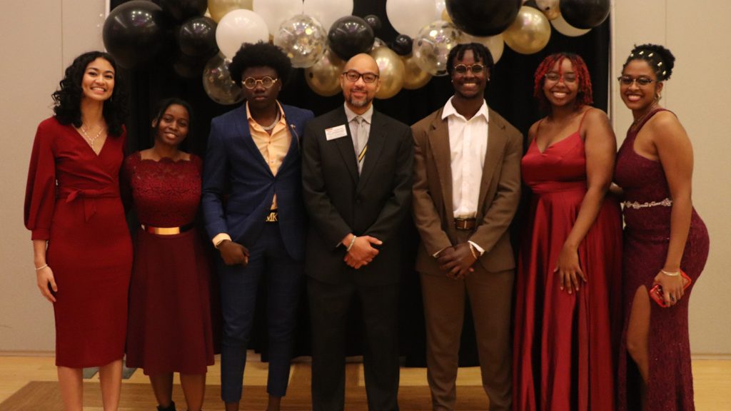 NSBE Gala attendees pose for a group photo.