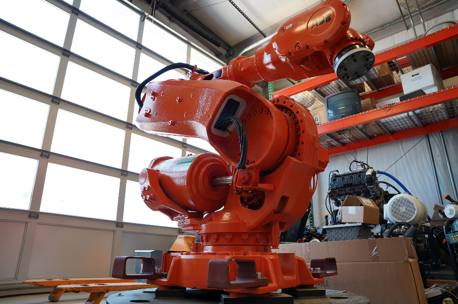 Orange painted industrial robot donated by ABB.