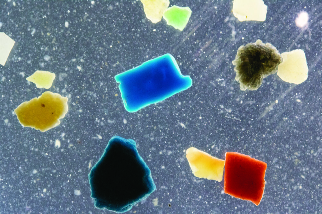 Closeup photo of microplastic pieces.