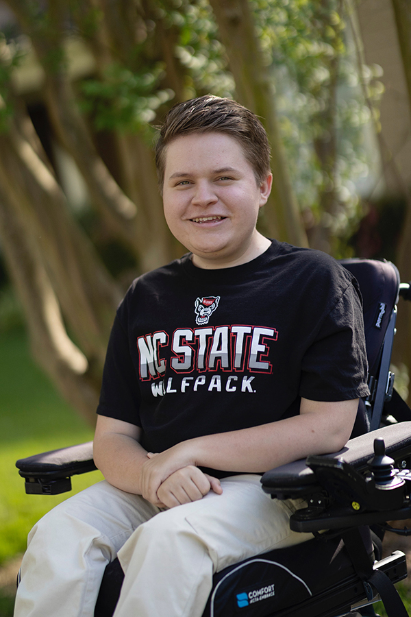 Jack Bolton poses for a photograph wearing a black NC State t-shirt.