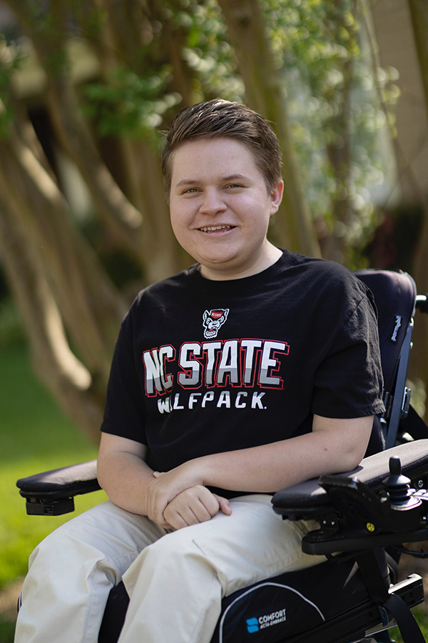 Jack Bolton poses for a photograph wearing a black NC State t-shirt.