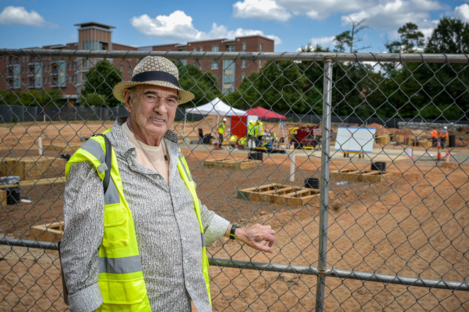 Artist Larry Bell stands near the construction site as Reds and Whites is installed on Centennial Campus.