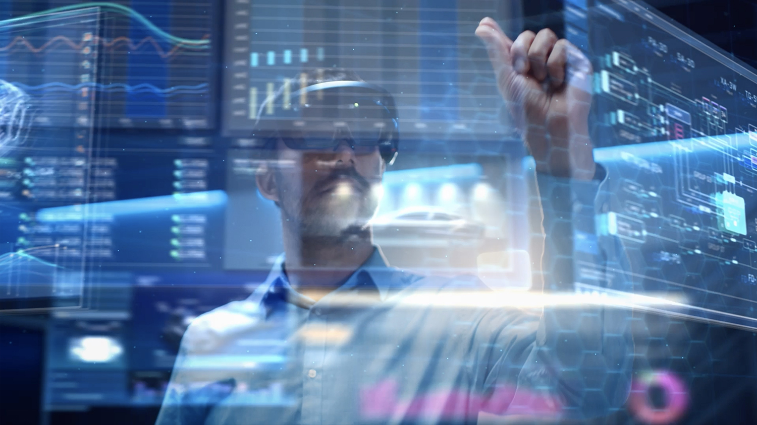 Man with virtual reality headset uses his left hand to virtually grasp an image.
