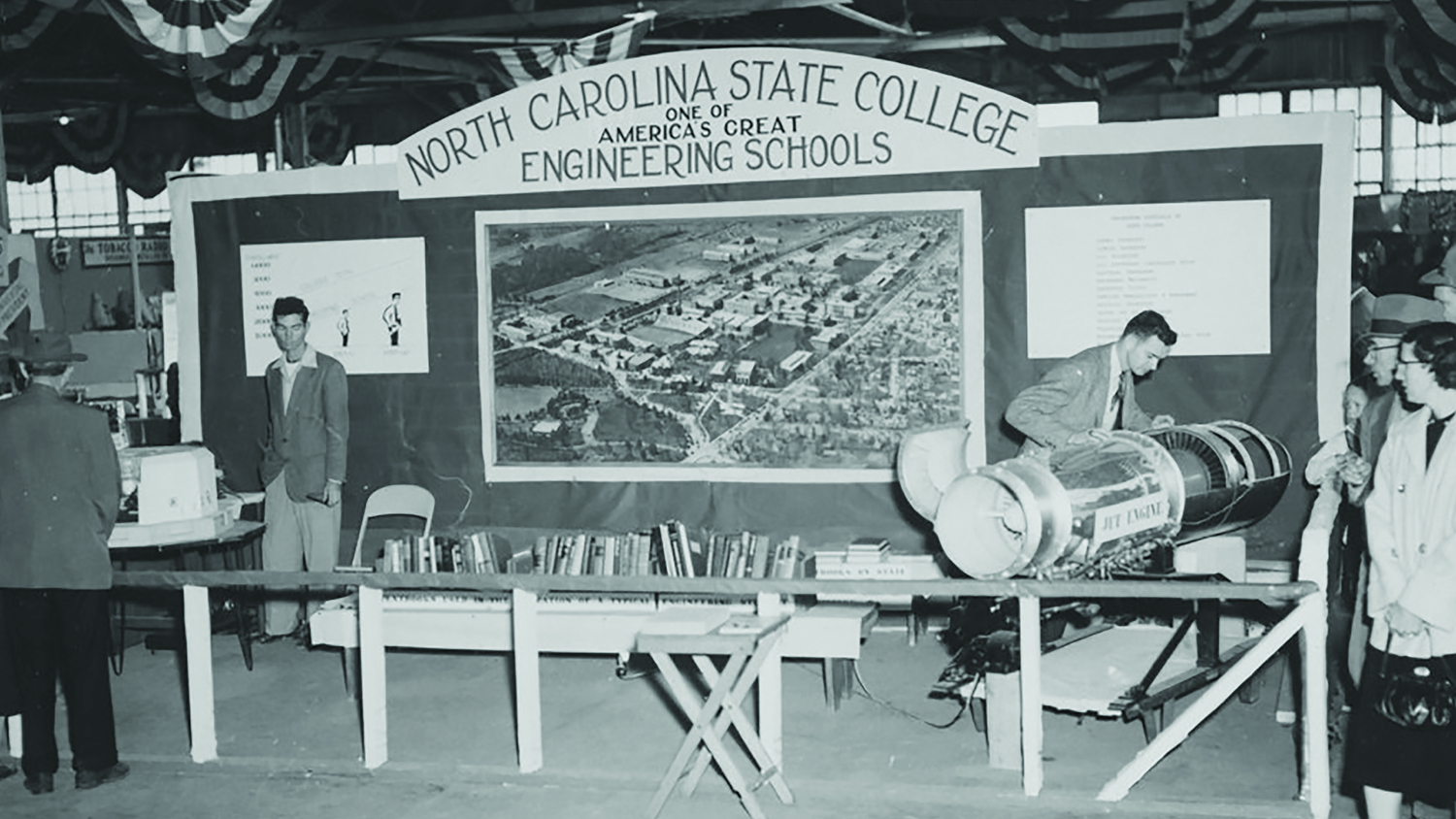 Black and white vintage photo of a College of Engineering booth at the NC State Fair in 1955.