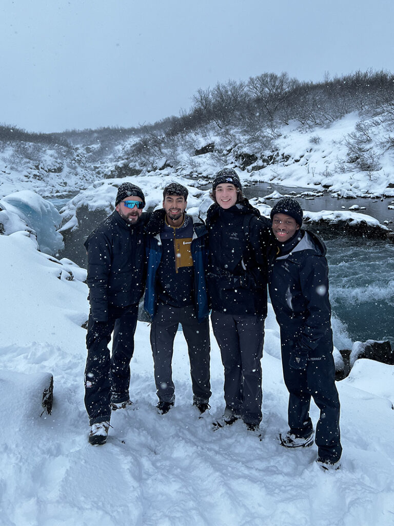 Manny Valbuena, second from left, poses for a photo in the snow with three friends.