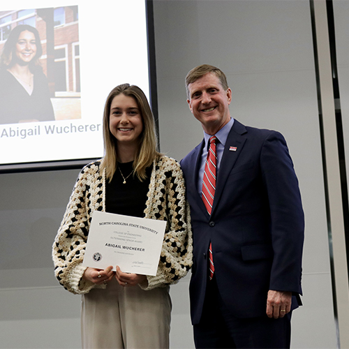 Abigail Wucherer, left, receives Outstanding Senior Award from Dr. Jerome Lavelle.