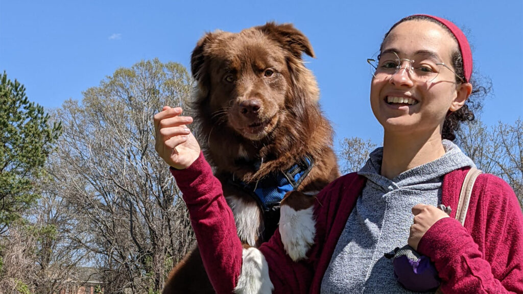 Dina Osama Elsayed Elgewaily, right, enjoy a sunny Spring day outside with her dog.