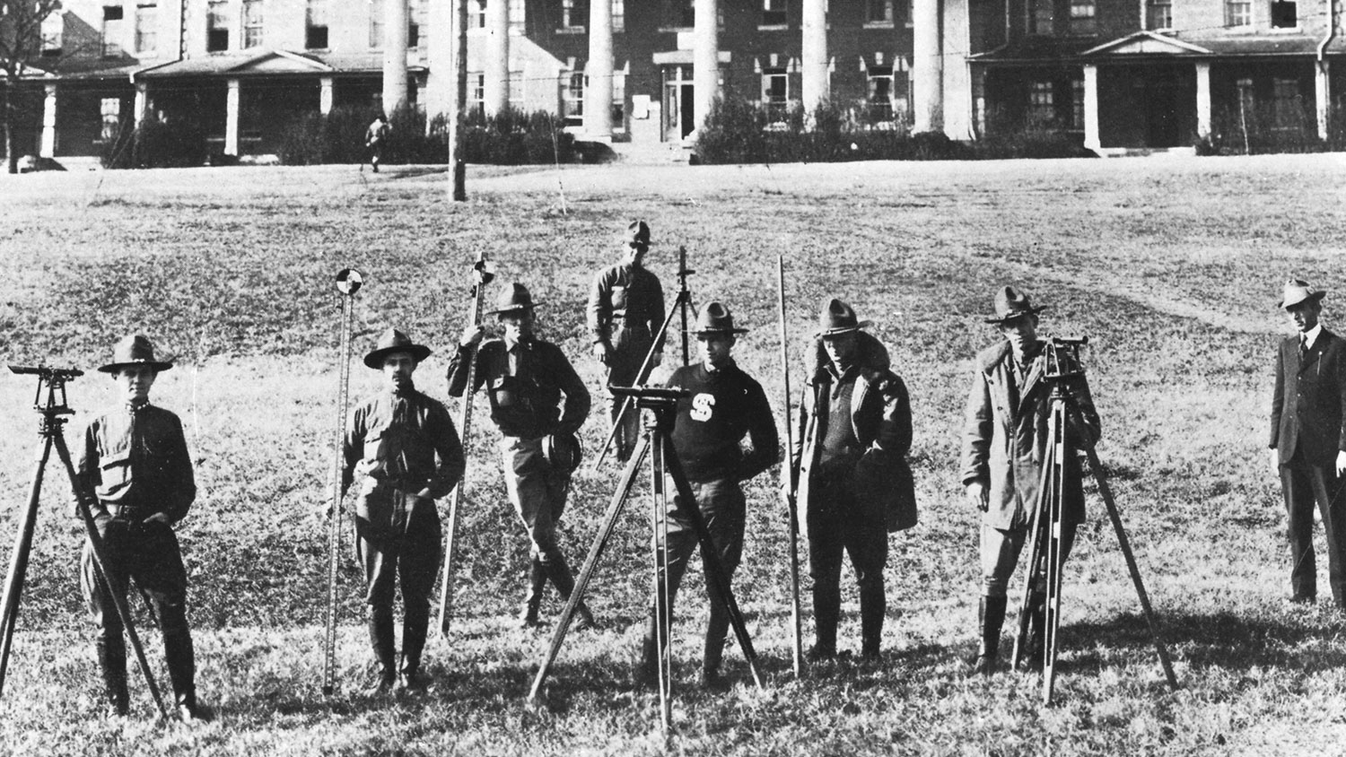 black and white photo of early 20th century survey squad