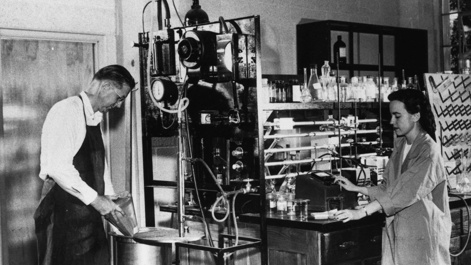 Professor Frances M. "Billie" Richardson (right) and male associate working in lab.