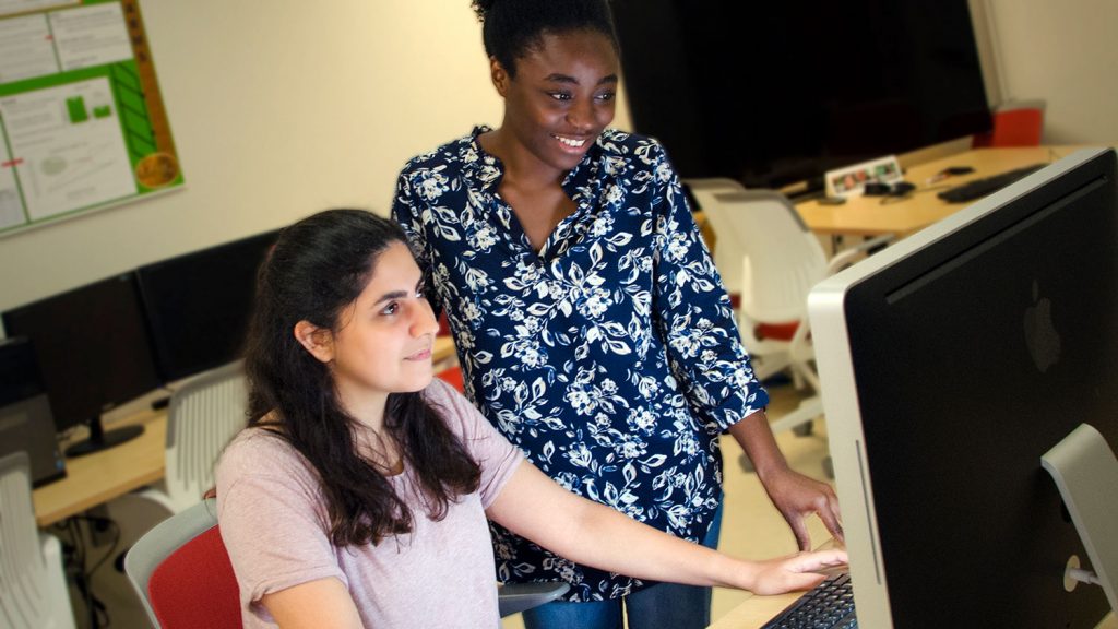 Industrial and systems engineering graduate students Kimia Vahdat, left, and Priscille Koutouan are part of an effort to attract more women students to the department.