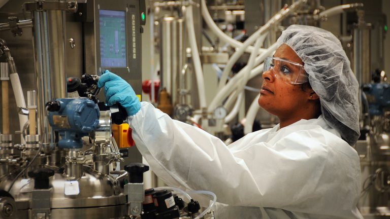 BTEC worker in cleanroom.