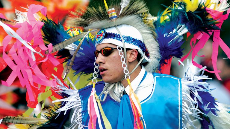 Engineering student dances in the men’s fancy during a Native American powwow at NC State.