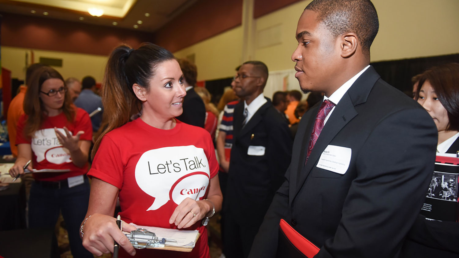 Canon rep talks to NC State student.