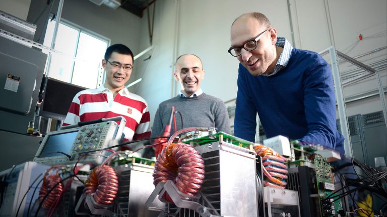 Electrical engineering researchers working in FREEDM lab