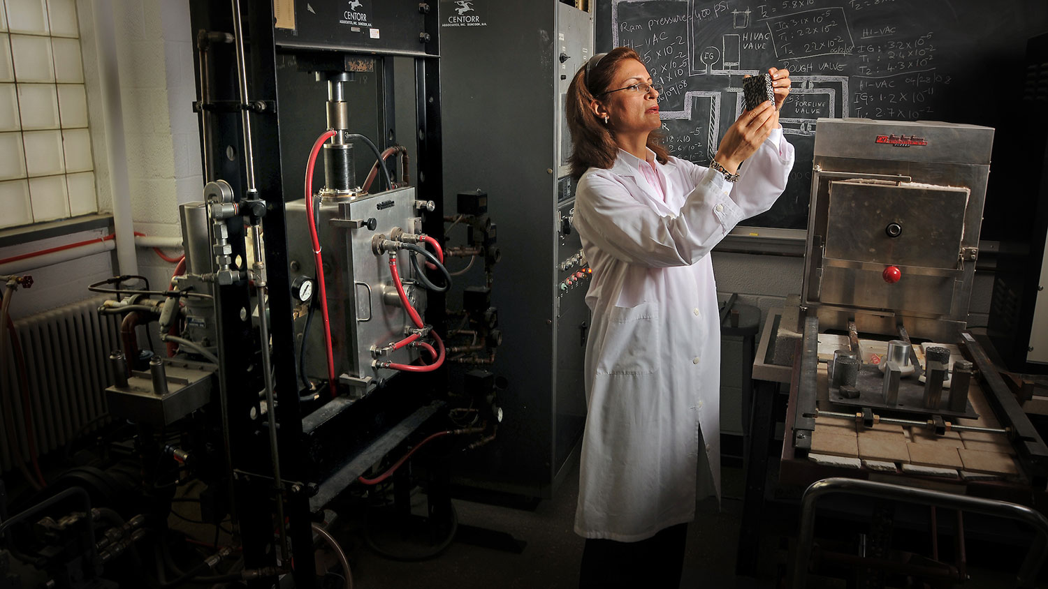 Afsaneh Rabiei checks on metallic foam created in her lab.